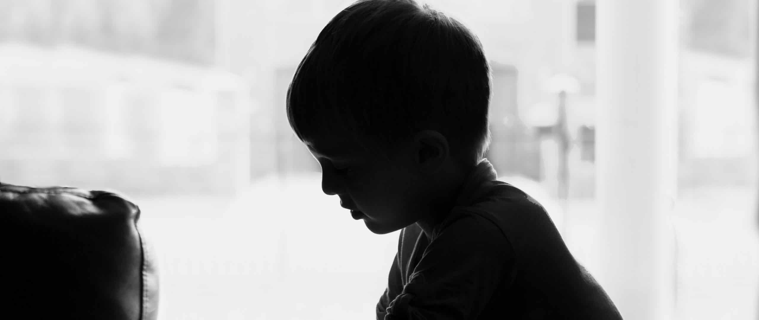 black and white photo of a kid