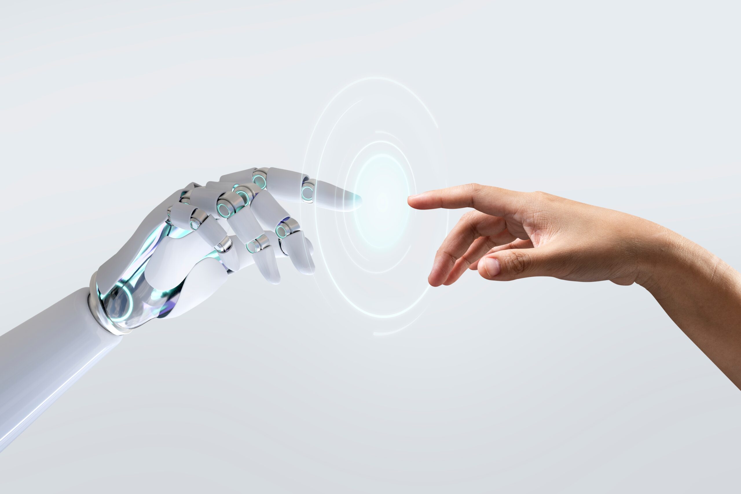 hand of a robot and hand of a human reaching to each other
