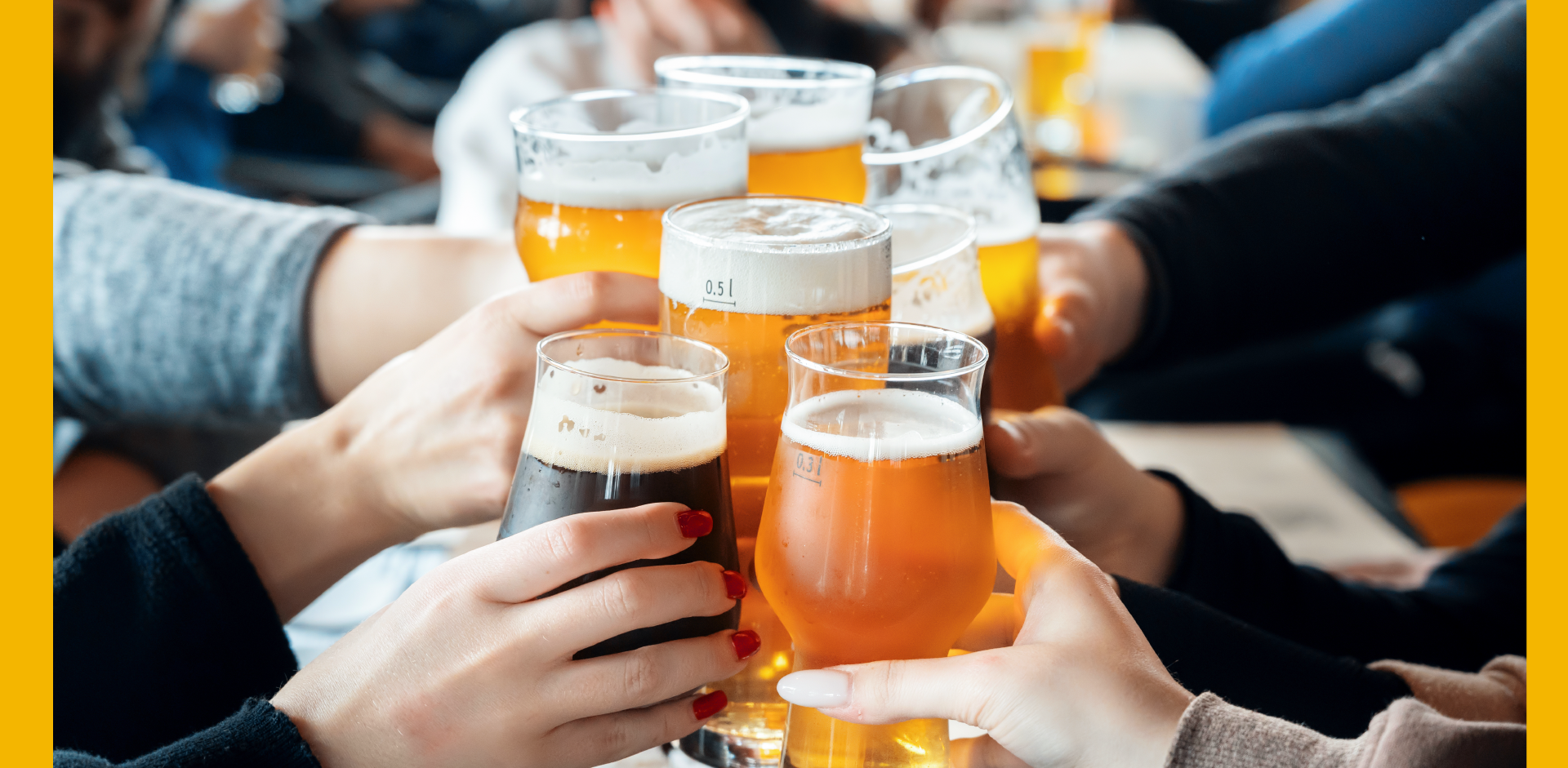 Group of people clinking glasses of beer at NYC T&S on Tap event
