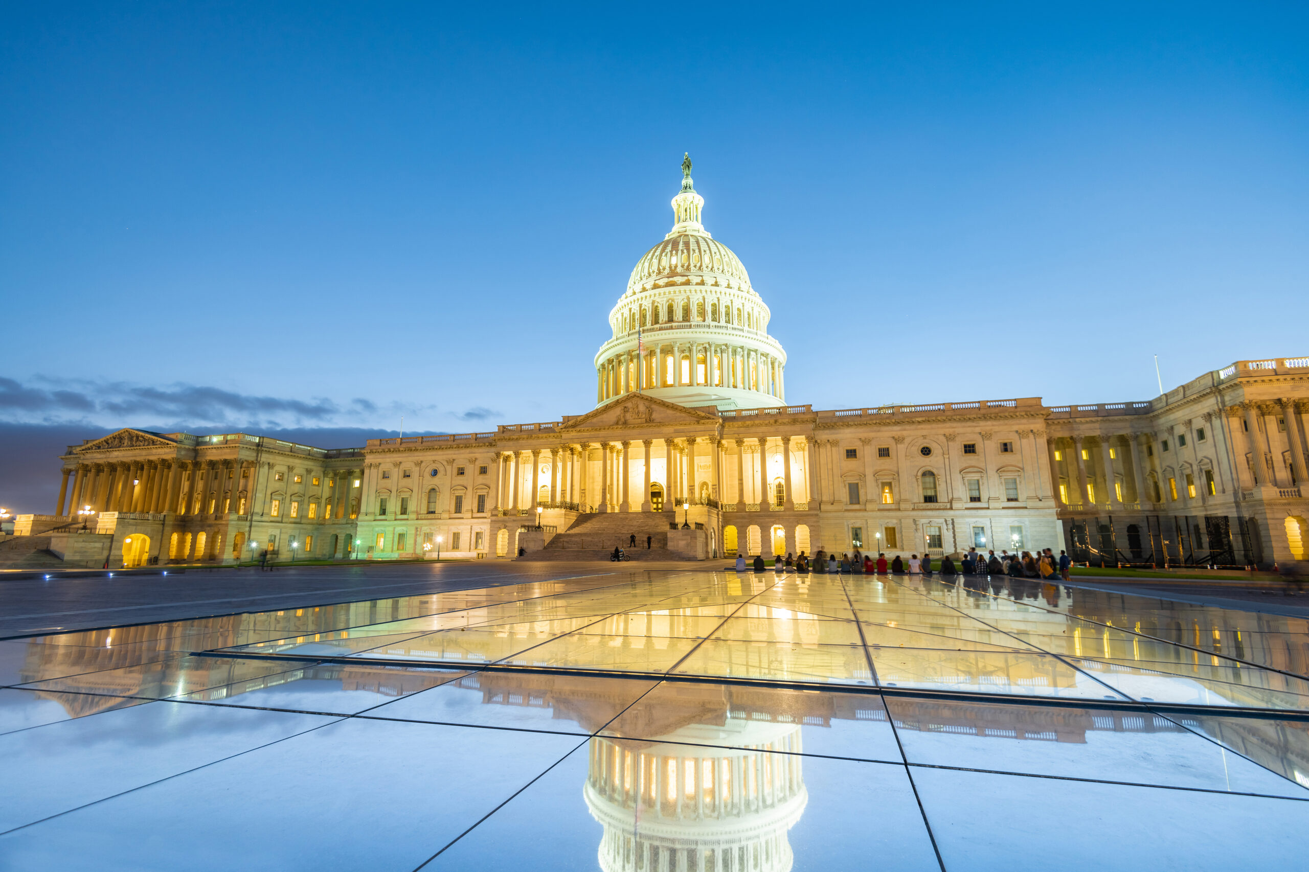 United States Capitol building illuminated at dusk, representing the State of the Net event
