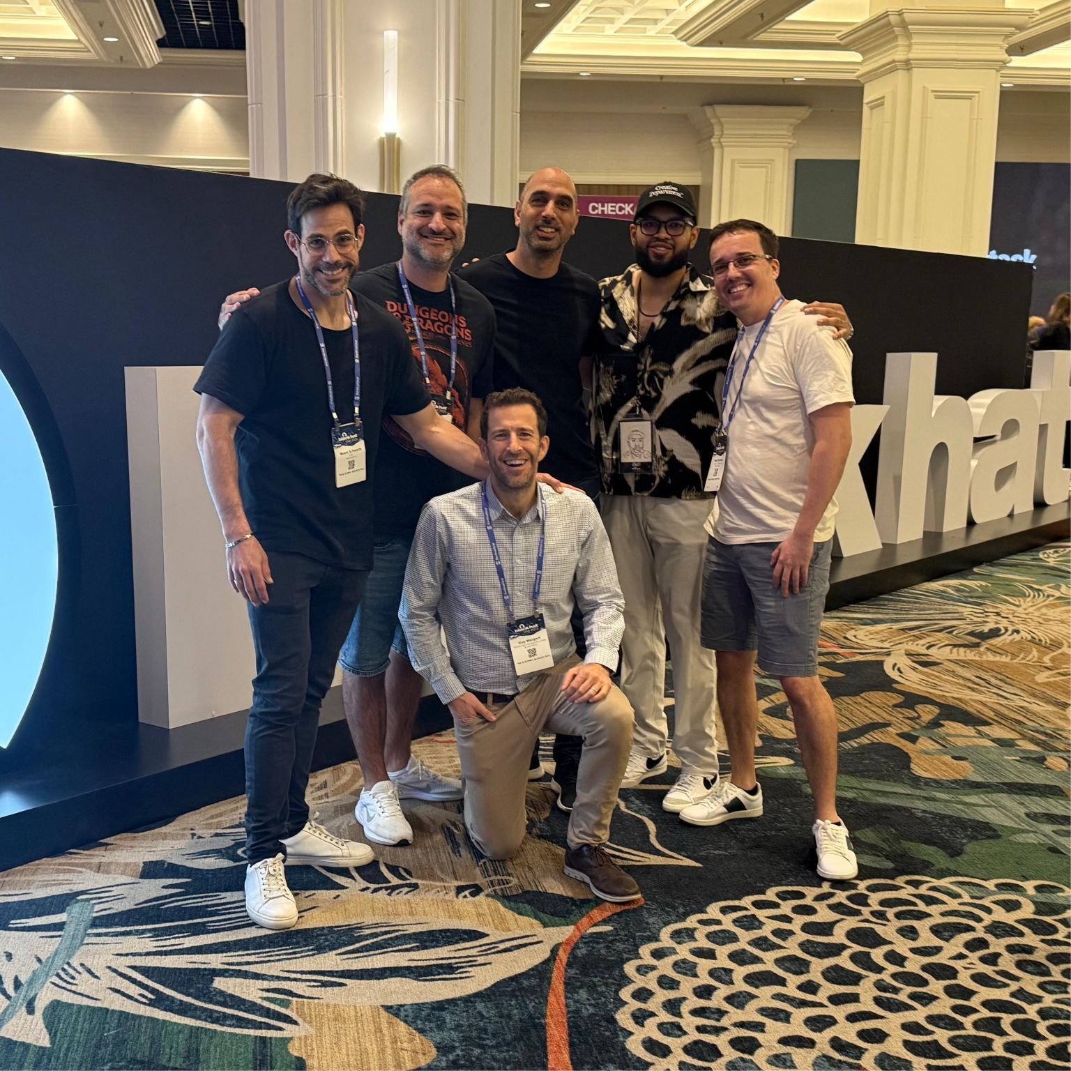 Team of ActiveFence leadership in front of blackhat sign, conference cyber security 2025